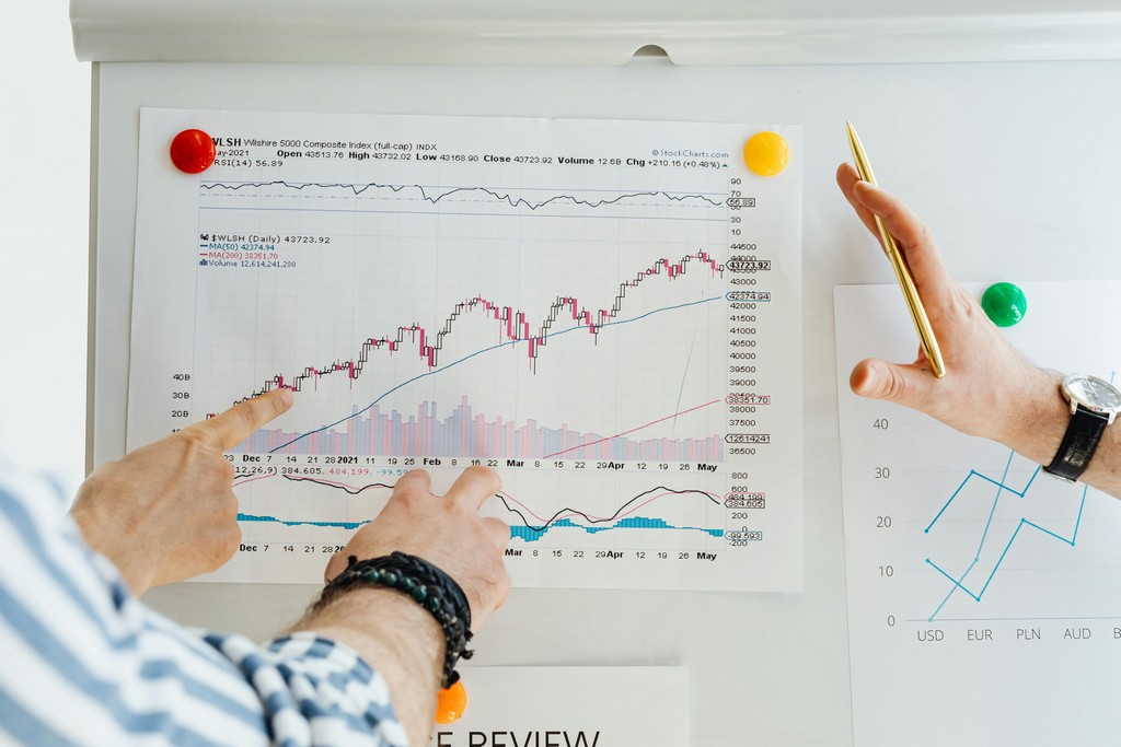 Financial advisor discussing investment goals and performance with a client.